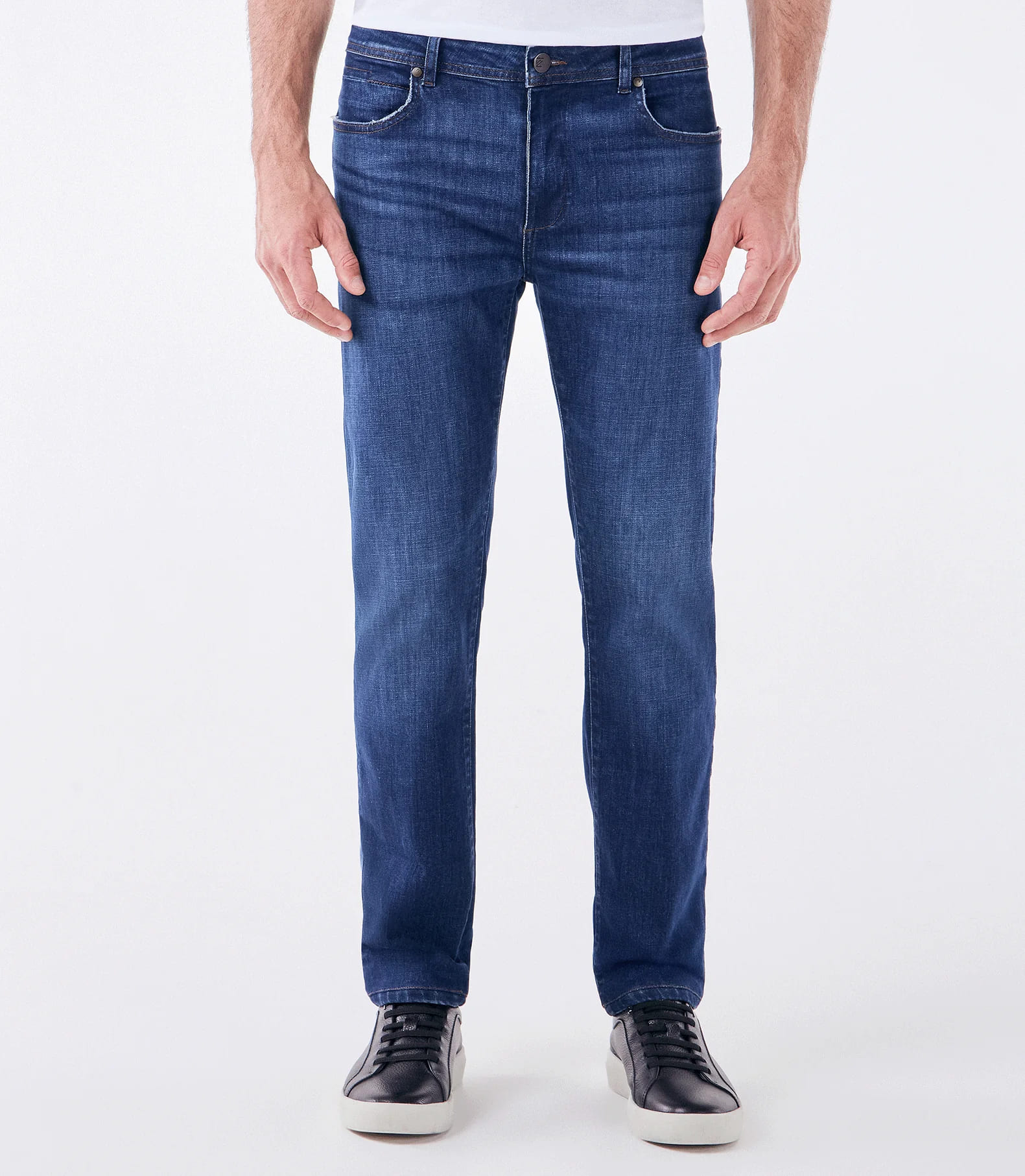 Man wearing blue denim jeans and sweater