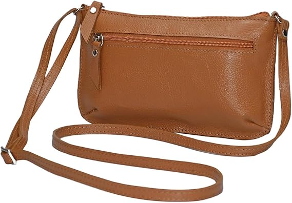 Brown leather handbag on table