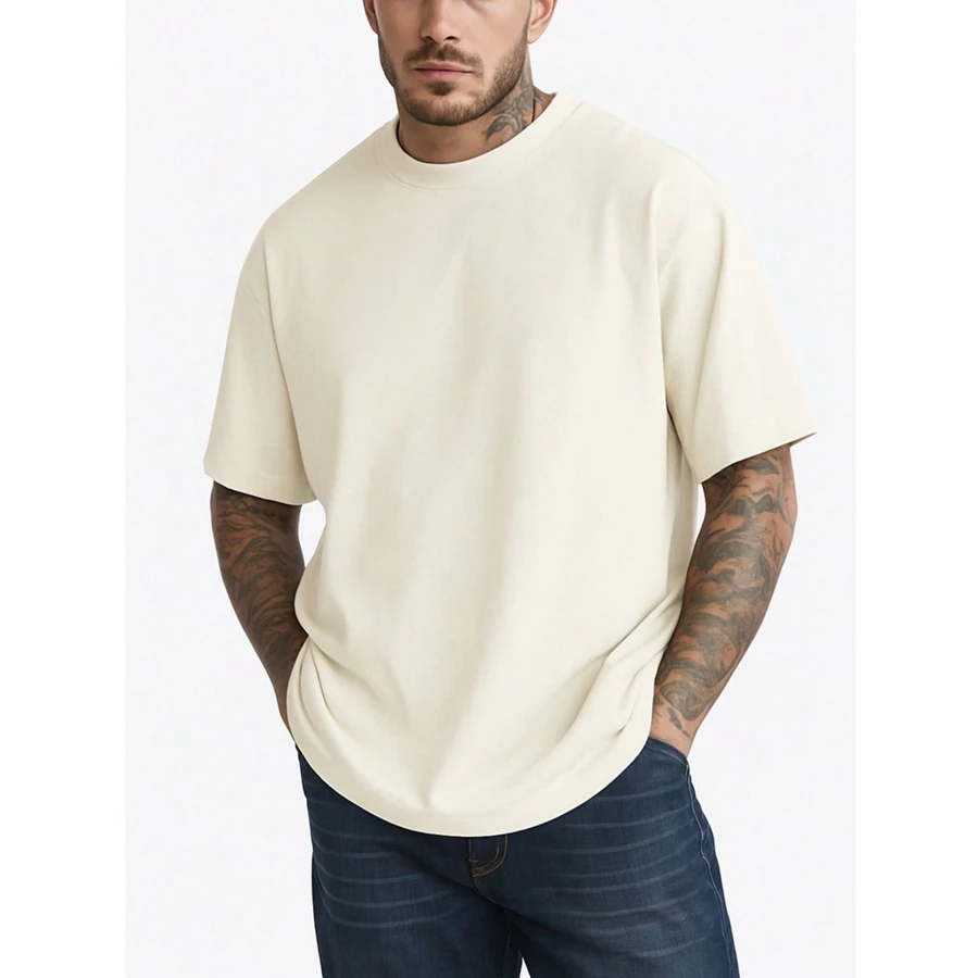 Man wearing beige oversized t-shirt
